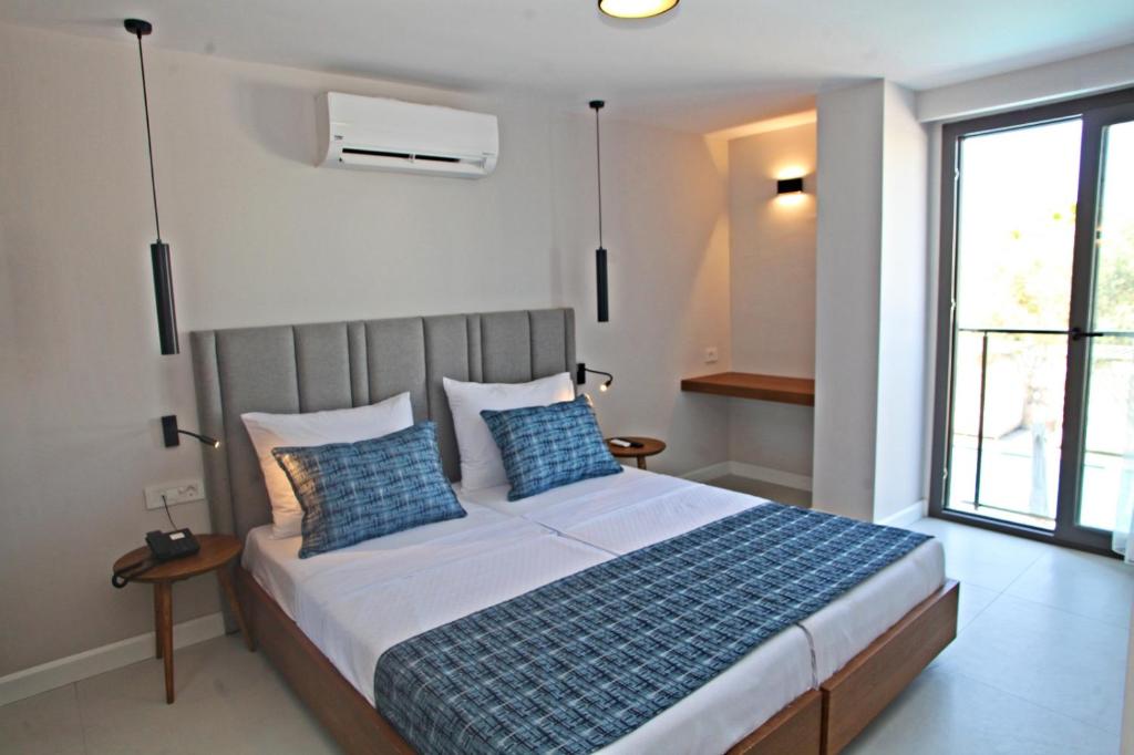 Postel nebo postele na pokoji v ubytování Queen Residences & Apart Hotel