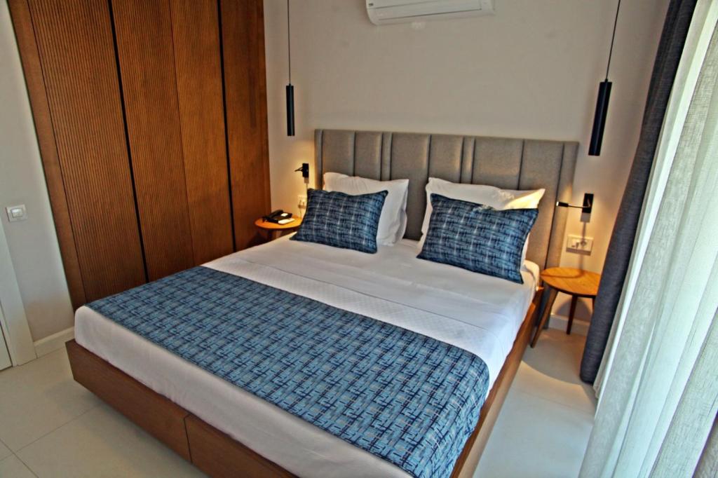 Postel nebo postele na pokoji v ubytování Queen Residences & Apart Hotel