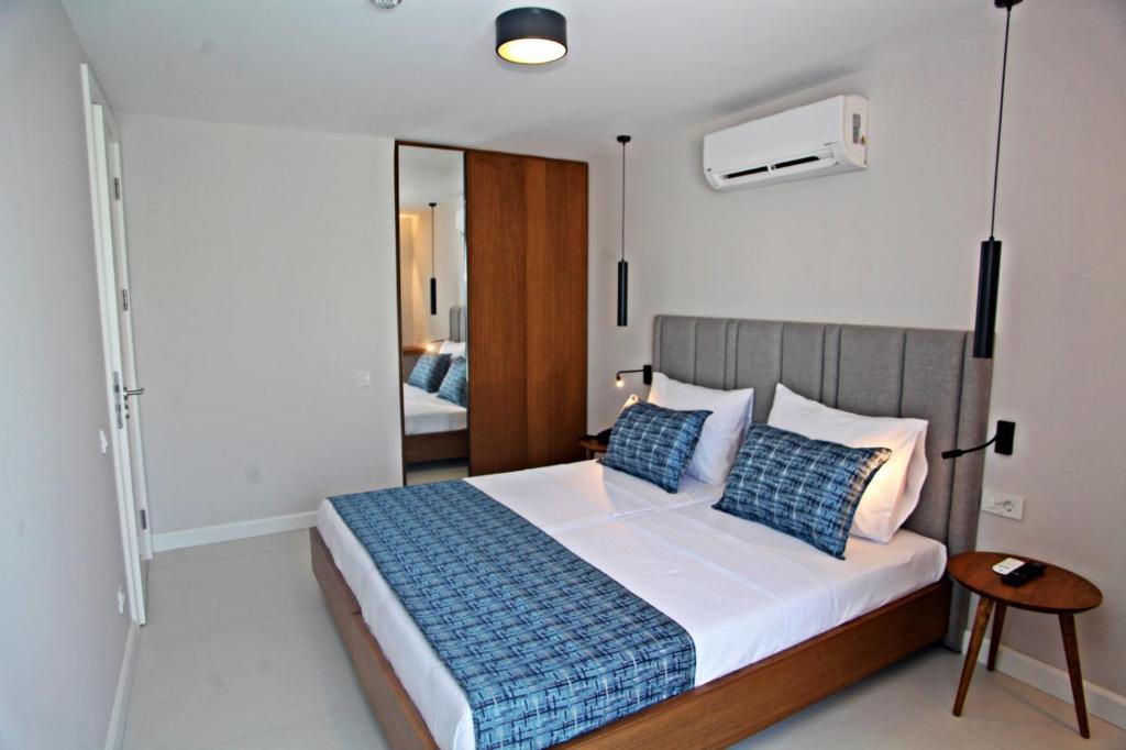 Postel nebo postele na pokoji v ubytování Queen Residences & Apart Hotel