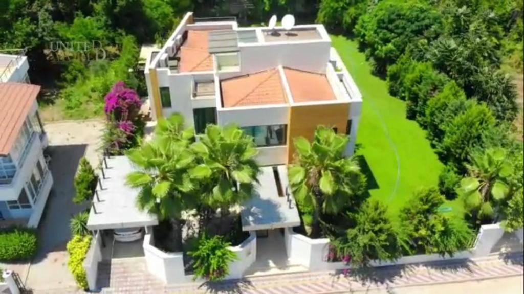 an aerial view of a house with palm trees at Villa Diva in Kemer