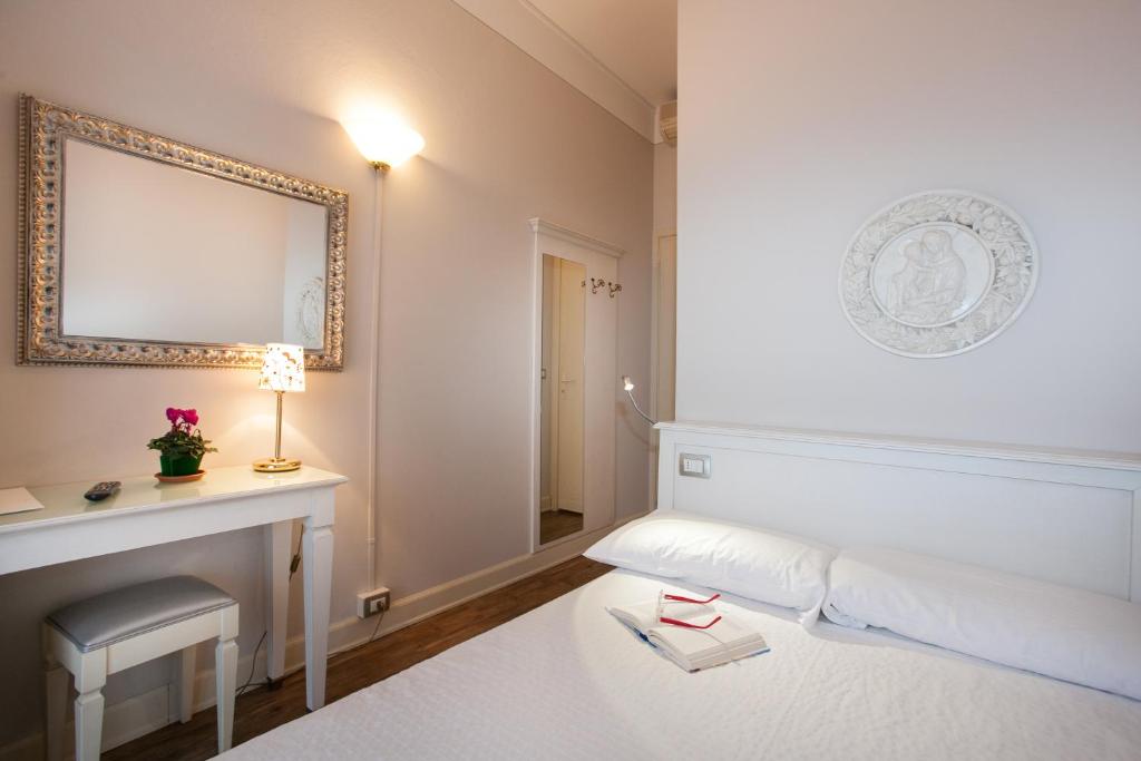 Postel nebo postele na pokoji v ubytování Hotel Marconi