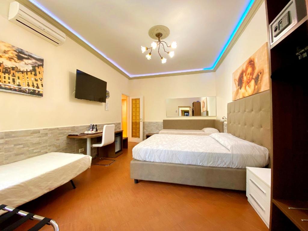 Łóżko lub łóżka w pokoju w obiekcie Hotel Ester