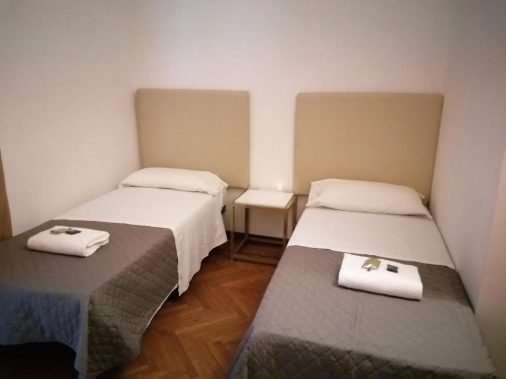 Postel nebo postele na pokoji v ubytování bellaria