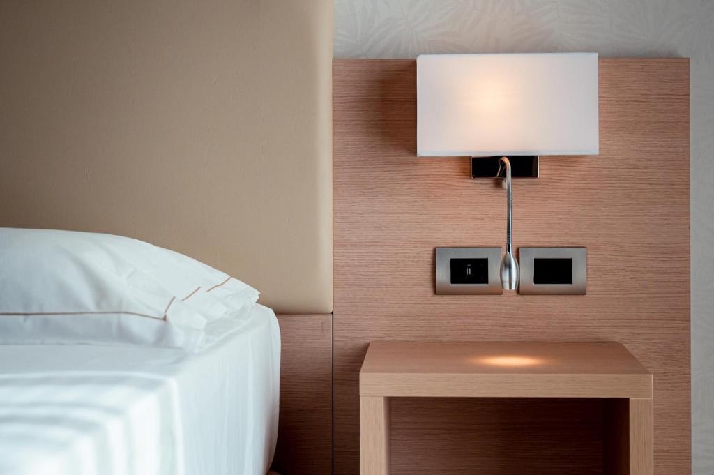 Postel nebo postele na pokoji v ubytování Hotel Continental
