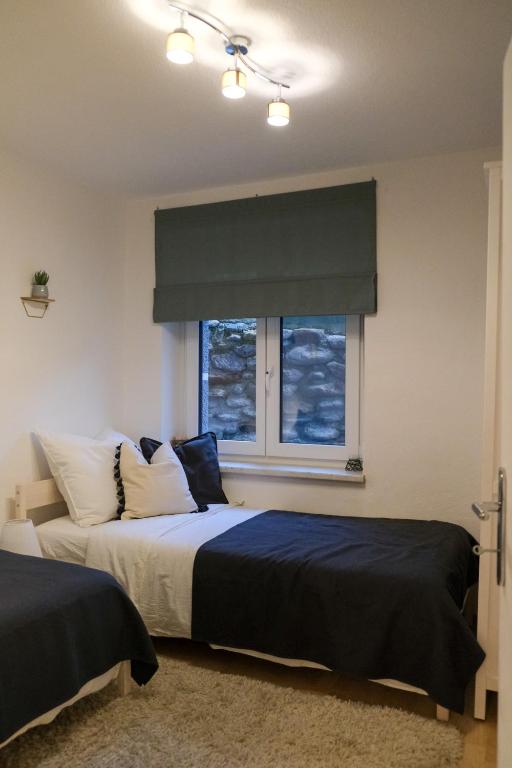 Postel nebo postele na pokoji v ubytování Apartment Danielsbergblick