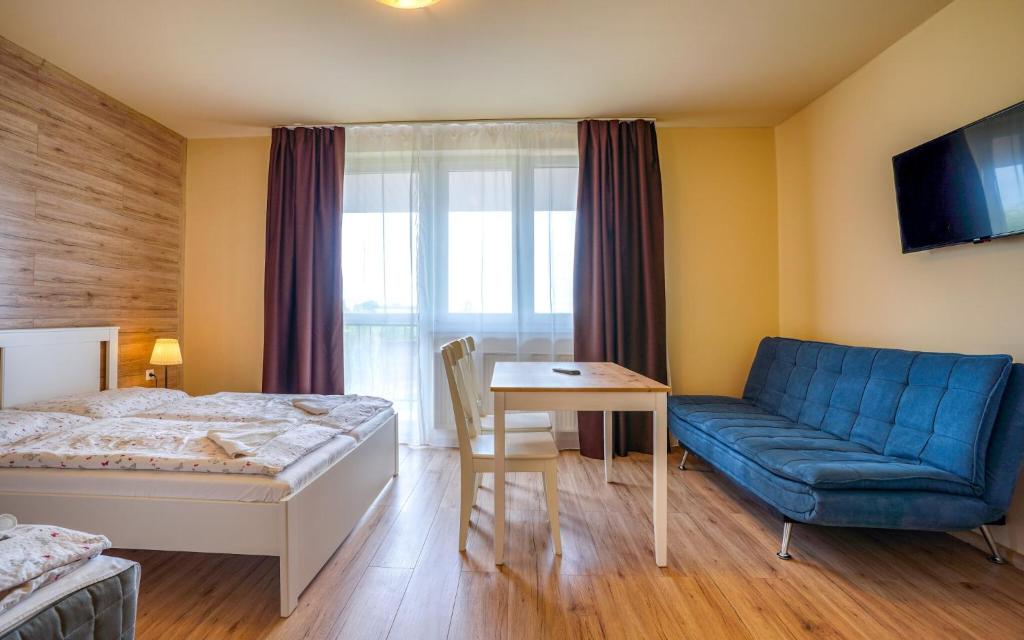 Posteľ alebo postele v izbe v ubytovaní Apartmány Karmon Park