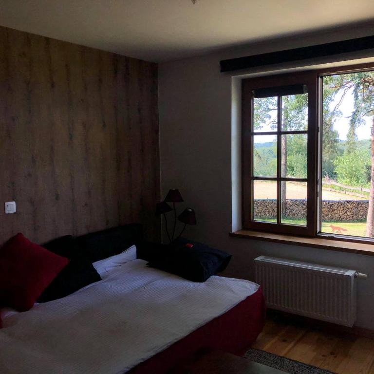 Postel nebo postele na pokoji v ubytování Le Goupil