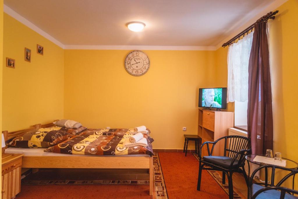 Postel nebo postele na pokoji v ubytování Penzion Samorost