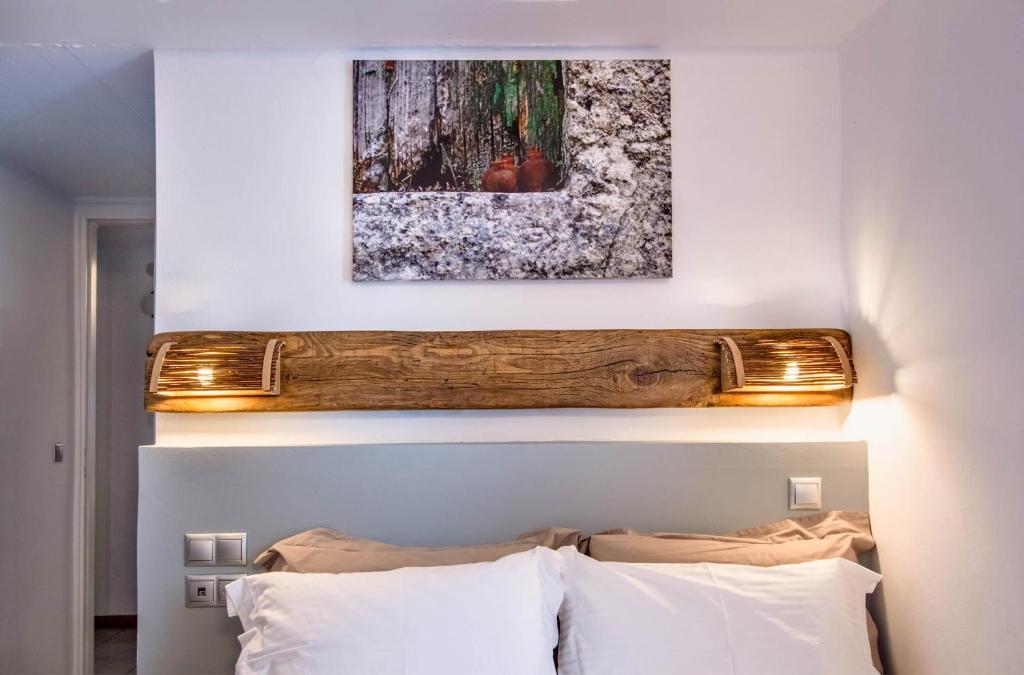 Postel nebo postele na pokoji v ubytování Nefeli Hotel