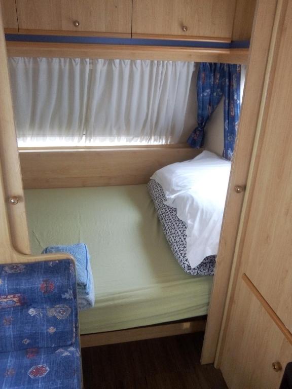 Postel nebo postele na pokoji v ubytování Les Chambres Studios de Pleslin-Foucher