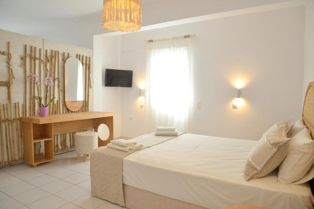 Postel nebo postele na pokoji v ubytování Hotel Apartments Giannis