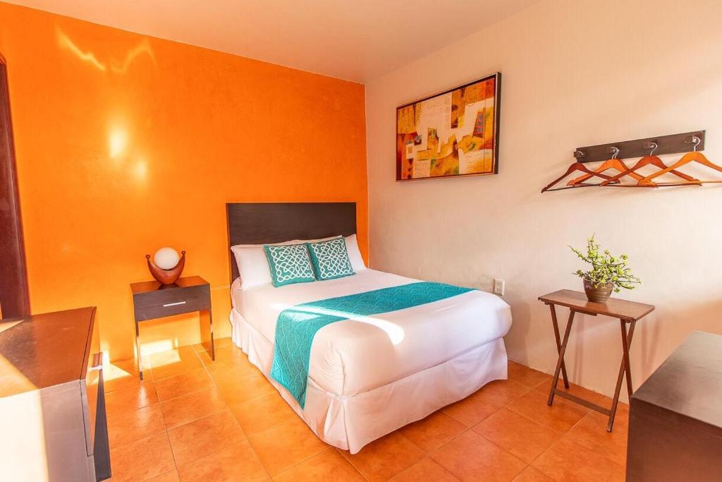 Postel nebo postele na pokoji v ubytování Hotel Doña Juana