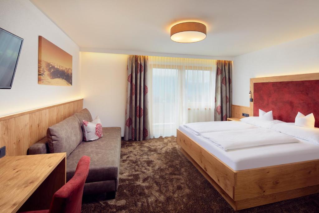 Postel nebo postele na pokoji v ubytování Hotel Gasthof Abelhof