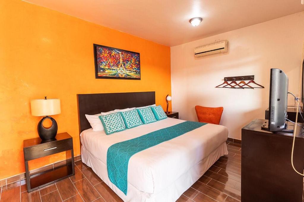 Postel nebo postele na pokoji v ubytování Hotel Doña Juana