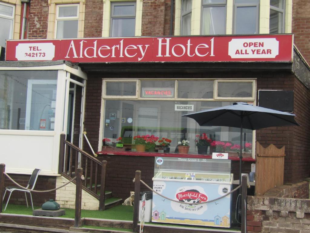 an umbrella in front of an oldady hotel at Alderley Hotel Blackpool in Blackpool