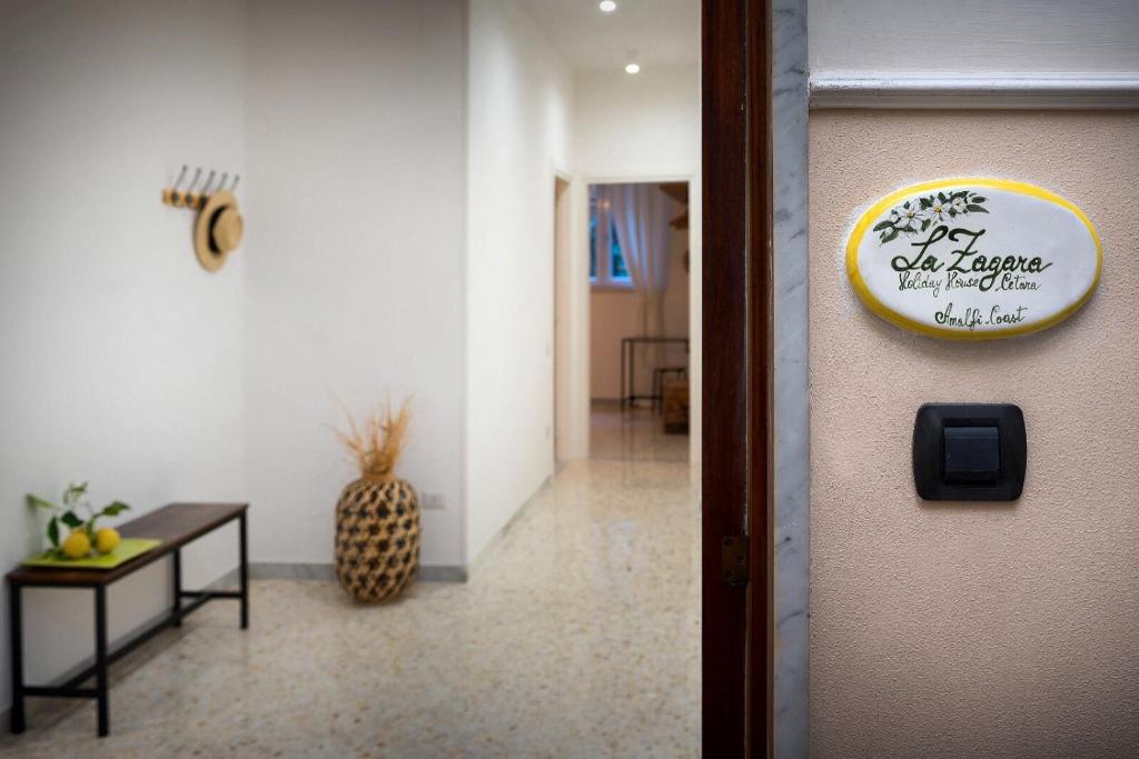 a sign on the door of a room at La Zagara Holiday House - Cetara - Amalfi Coast in Cetara