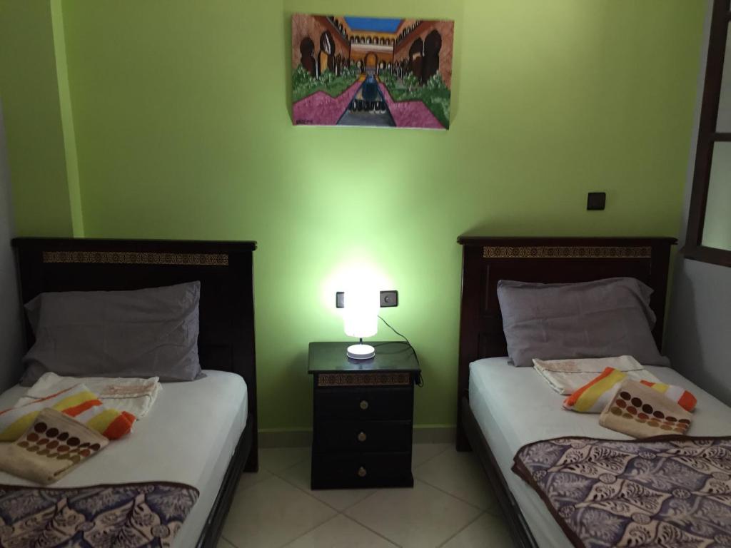 Una cama o camas en una habitación de TanjaLucia Hostel