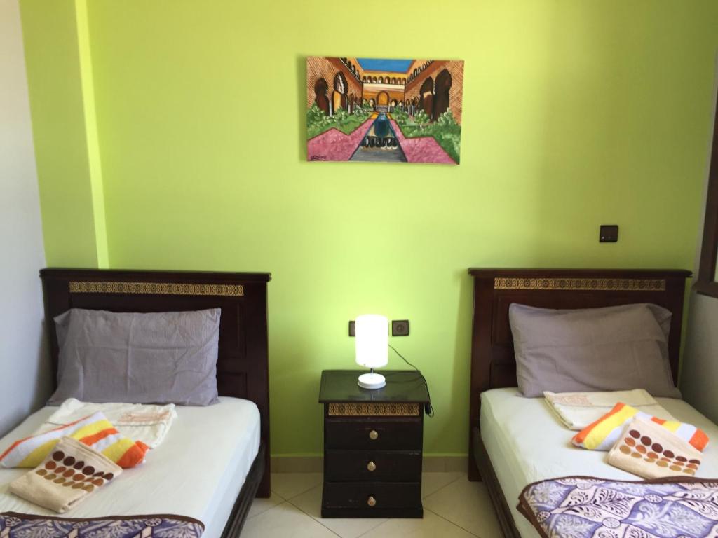 Una cama o camas en una habitación de TanjaLucia Hostel