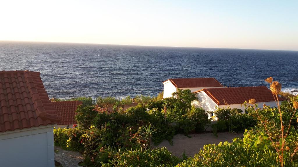 a view of the ocean from a building at Muses sea view bungalow in Armenistis