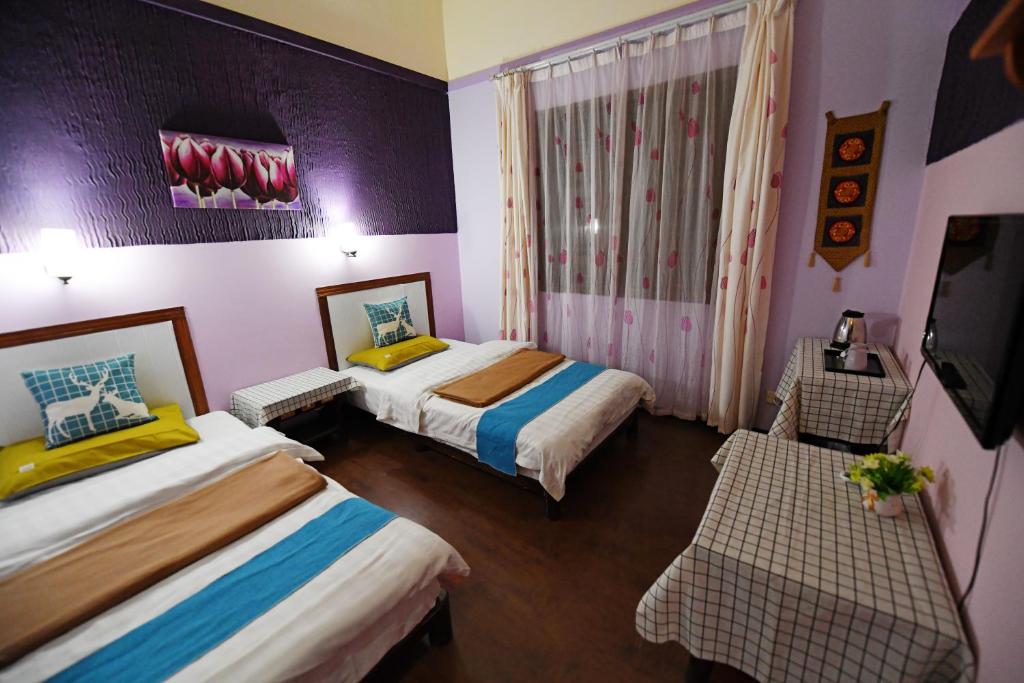 Postel nebo postele na pokoji v ubytování Maple Leaf Inn
