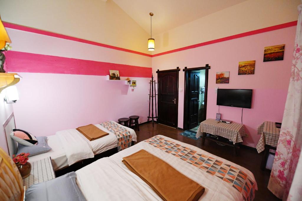 Postel nebo postele na pokoji v ubytování Maple Leaf Inn