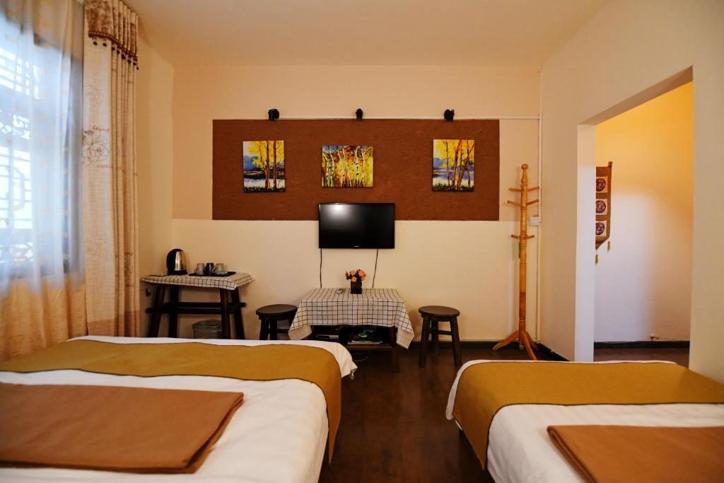 Postel nebo postele na pokoji v ubytování Maple Leaf Inn