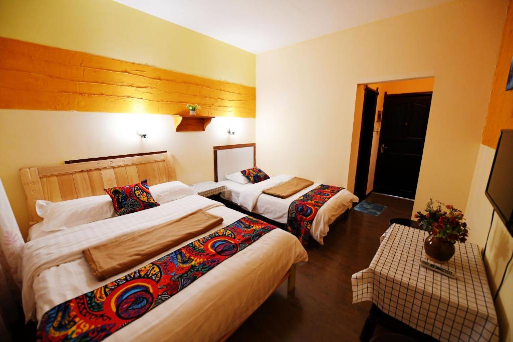 Postel nebo postele na pokoji v ubytování Maple Leaf Inn