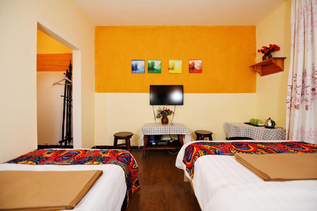 Postel nebo postele na pokoji v ubytování Maple Leaf Inn