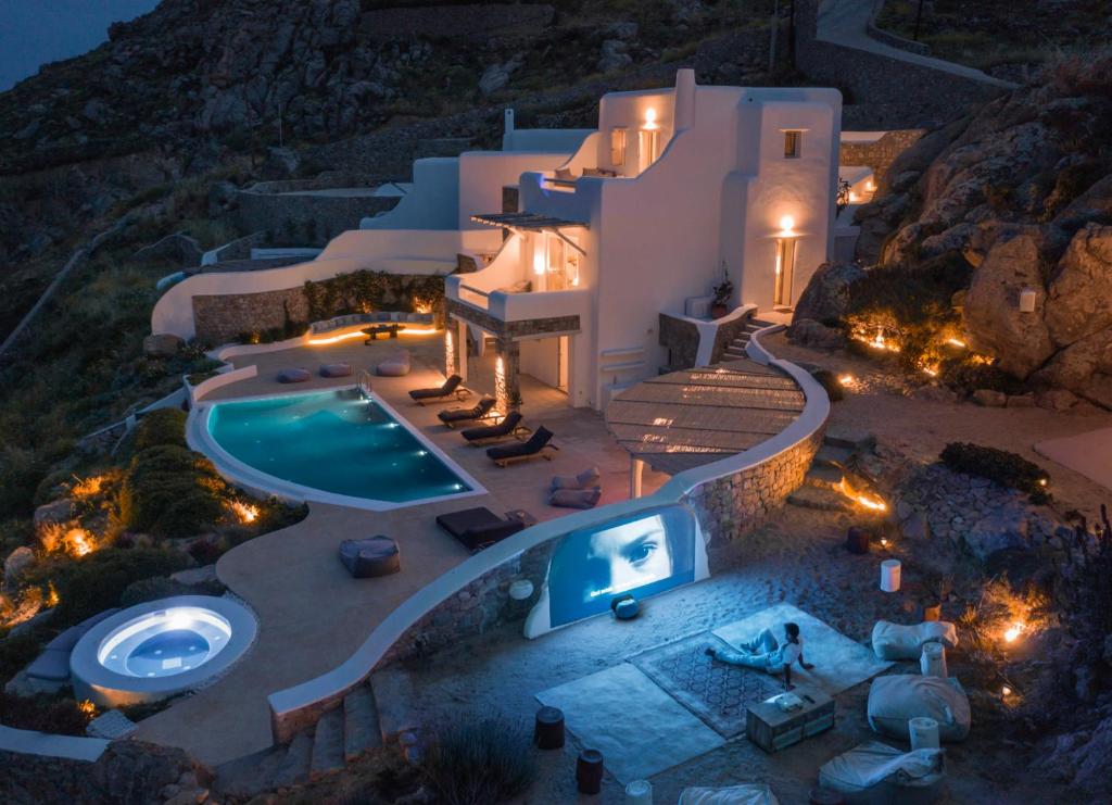 an image of a villa with a swimming pool at night at Villa Maera 2 in Kalo Livadi