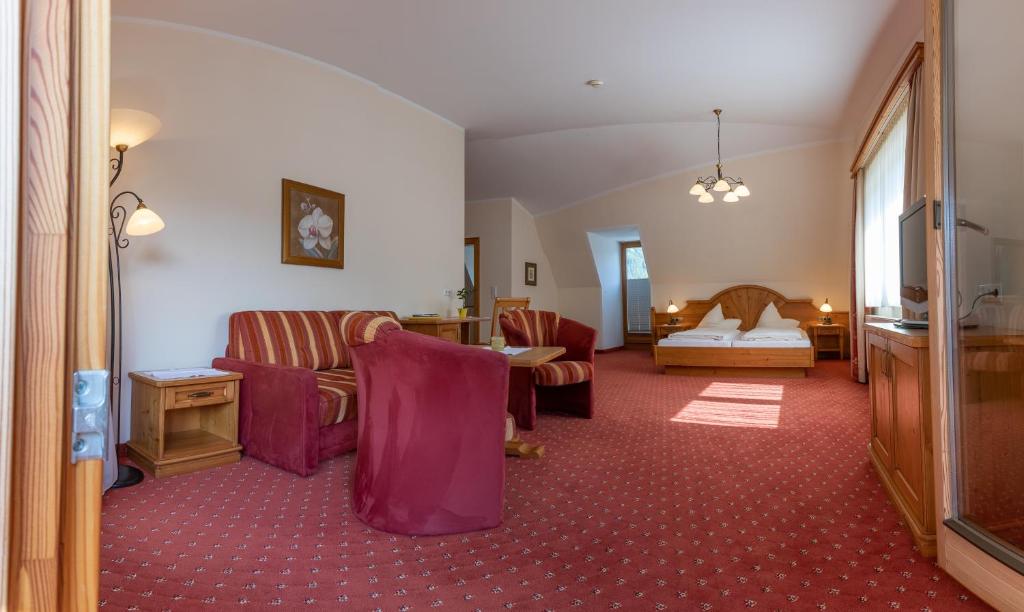 Postel nebo postele na pokoji v ubytování Hotel Garni Elisabeth