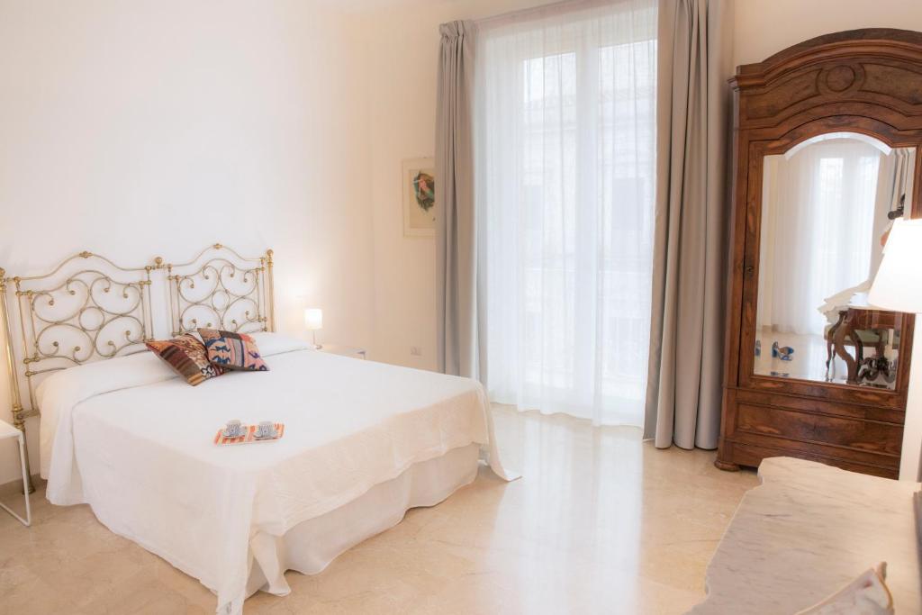 Posteľ alebo postele v izbe v ubytovaní Residenza Lago