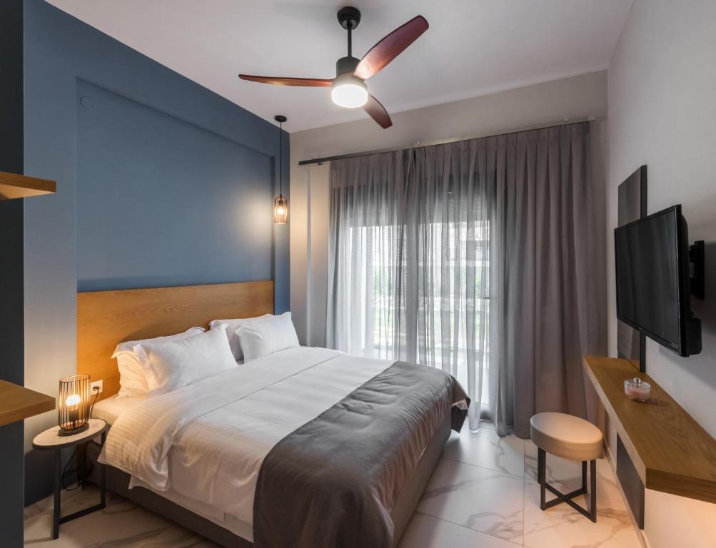 Postel nebo postele na pokoji v ubytování PLOUMIS seaside villas