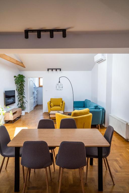 a living room with a table and chairs at WONDER CRACOW in Krakow