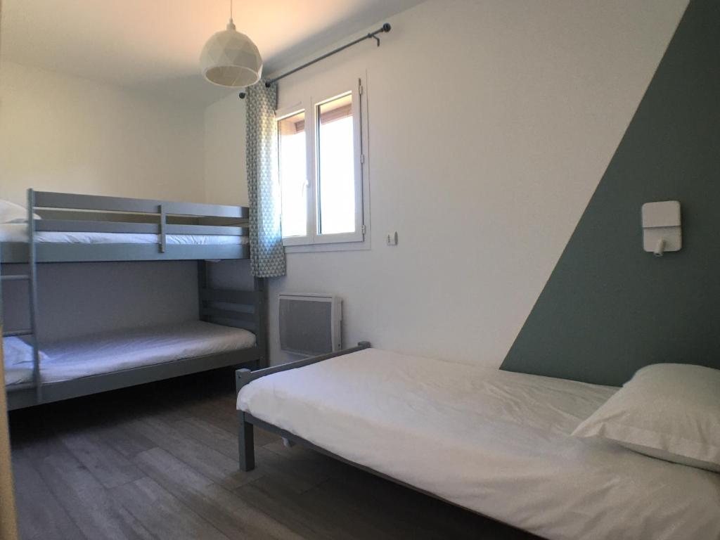 Tempat tidur susun dalam kamar di Hameau de Biscaye