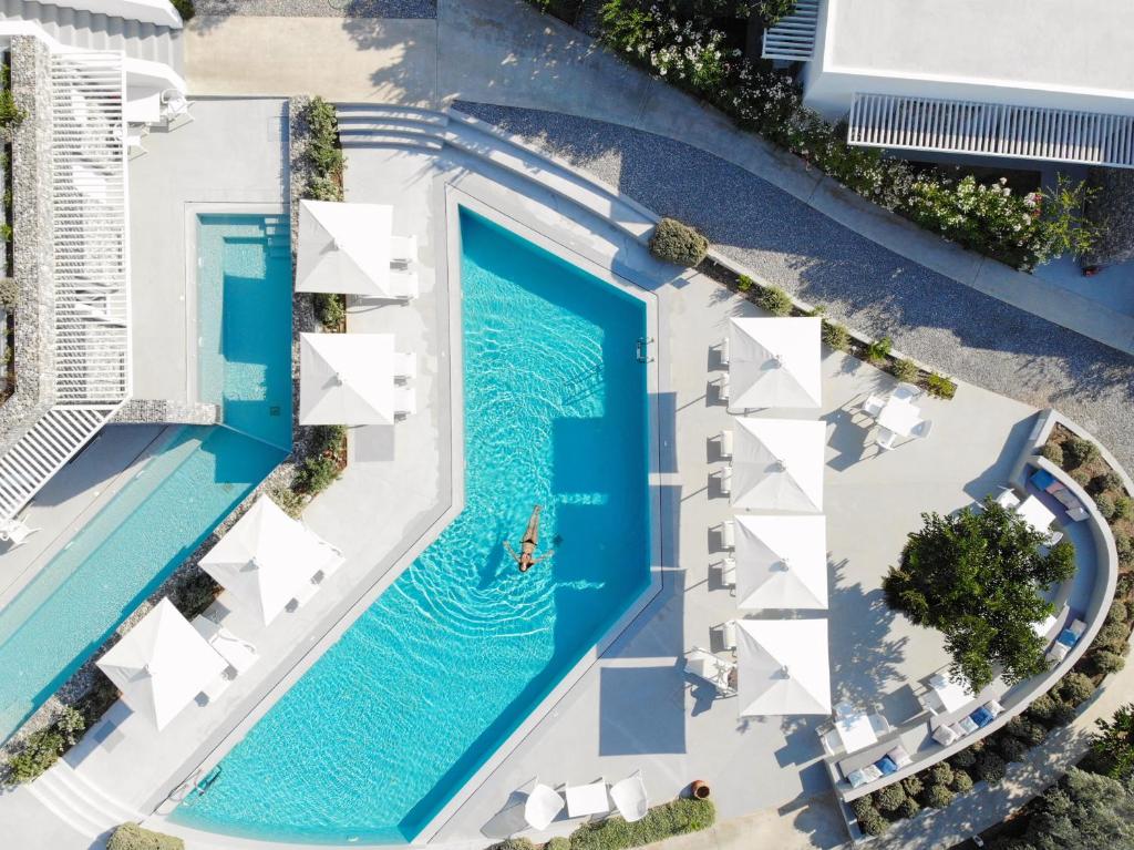 an overhead view of a swimming pool at a resort at Relux Ios Hotel in Ios Chora