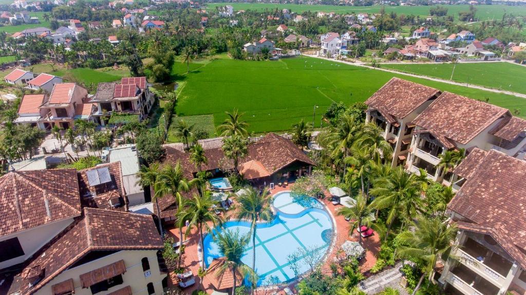
a large building with a lot of trees on top of it at Hoi An Trails Resort & Spa in Hoi An
