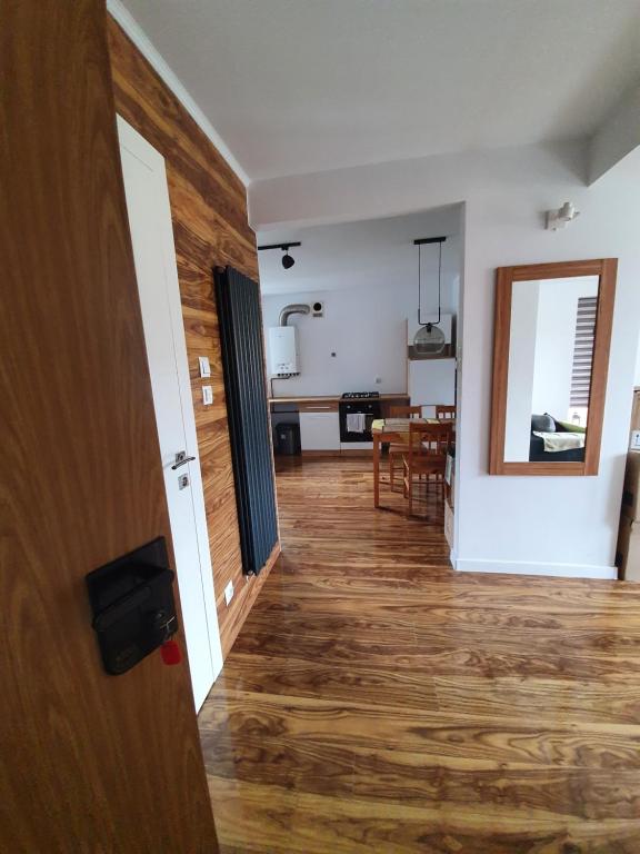 a hallway with a living room and a dining room at Apartament Lux in Koszalin