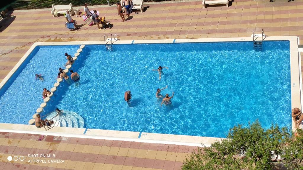 a group of people in a swimming pool at CALAFELL 5 BEACH in Calafell