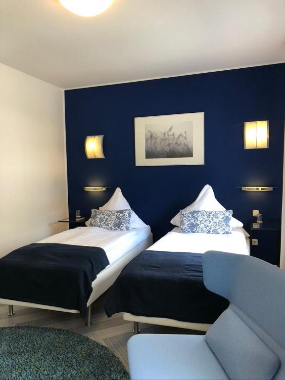 Postel nebo postele na pokoji v ubytování bensons hotel