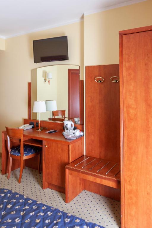 Postel nebo postele na pokoji v ubytování Hotel Olivo