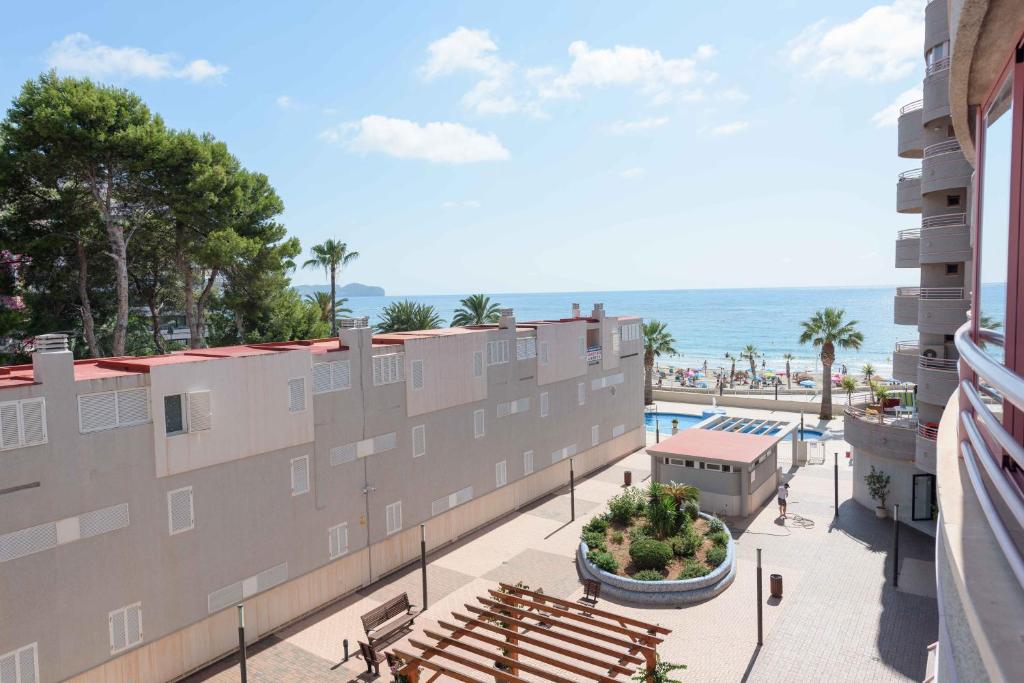 a view of the ocean from the balcony of a building at Apartamentos Nuevo México C 432 in Calpe