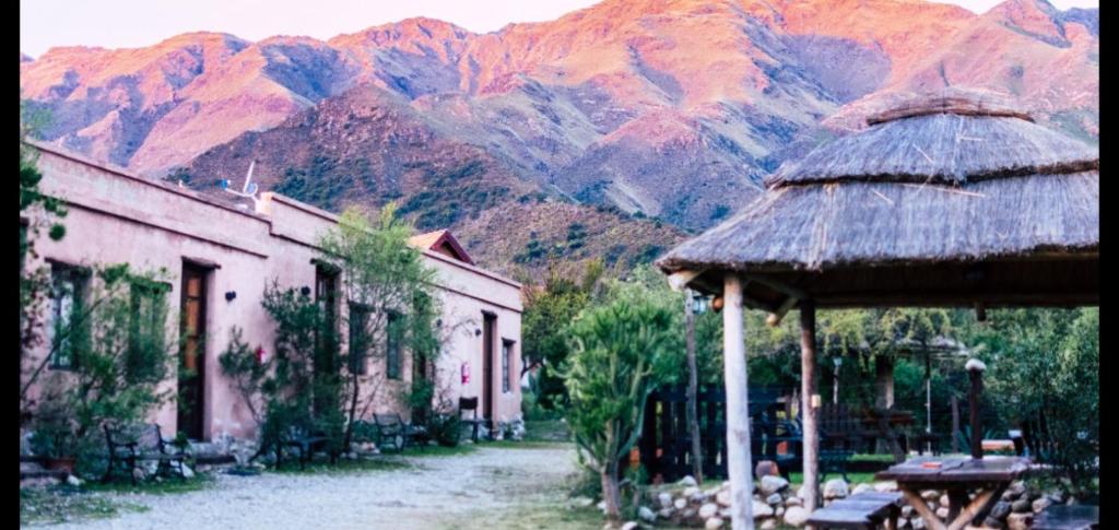 a view of a village with mountains in the background at Los Remolinos in Merlo