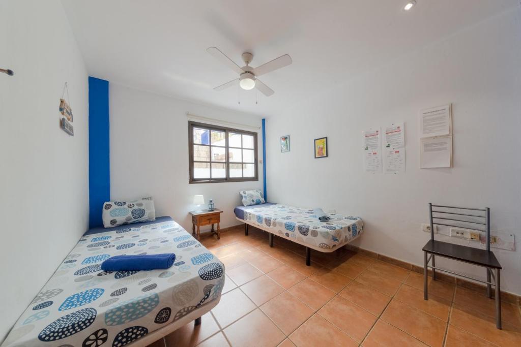 Postel nebo postele na pokoji v ubytování La Tortuga Hostel