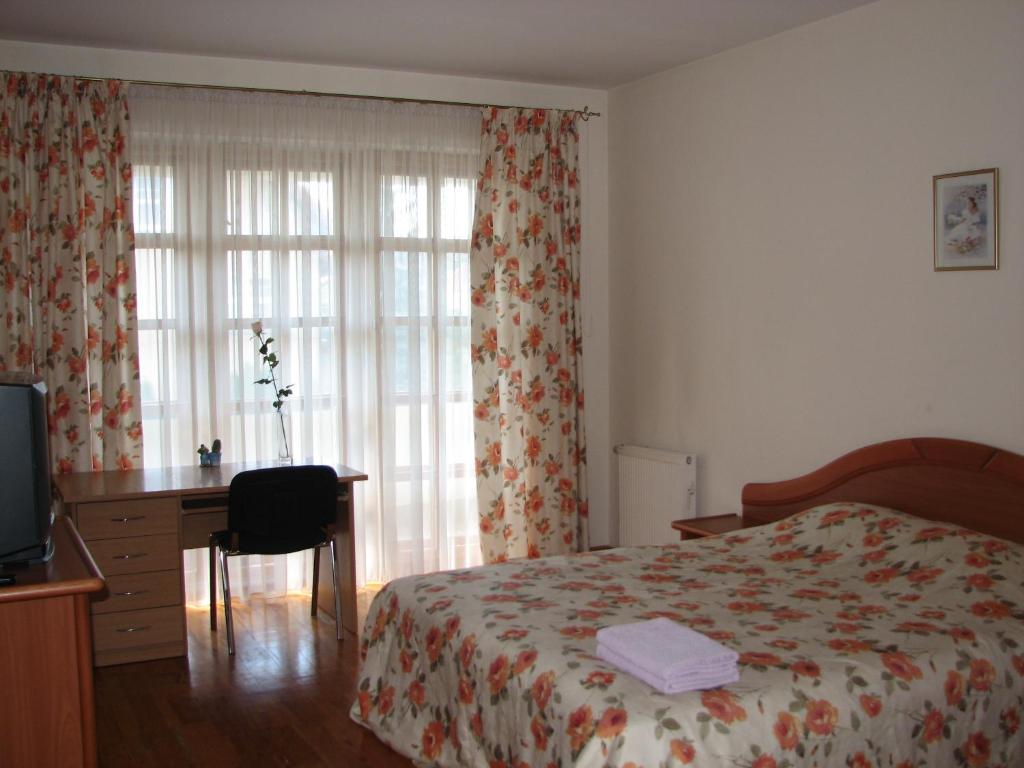 Postel nebo postele na pokoji v ubytování Little Amber Apartments