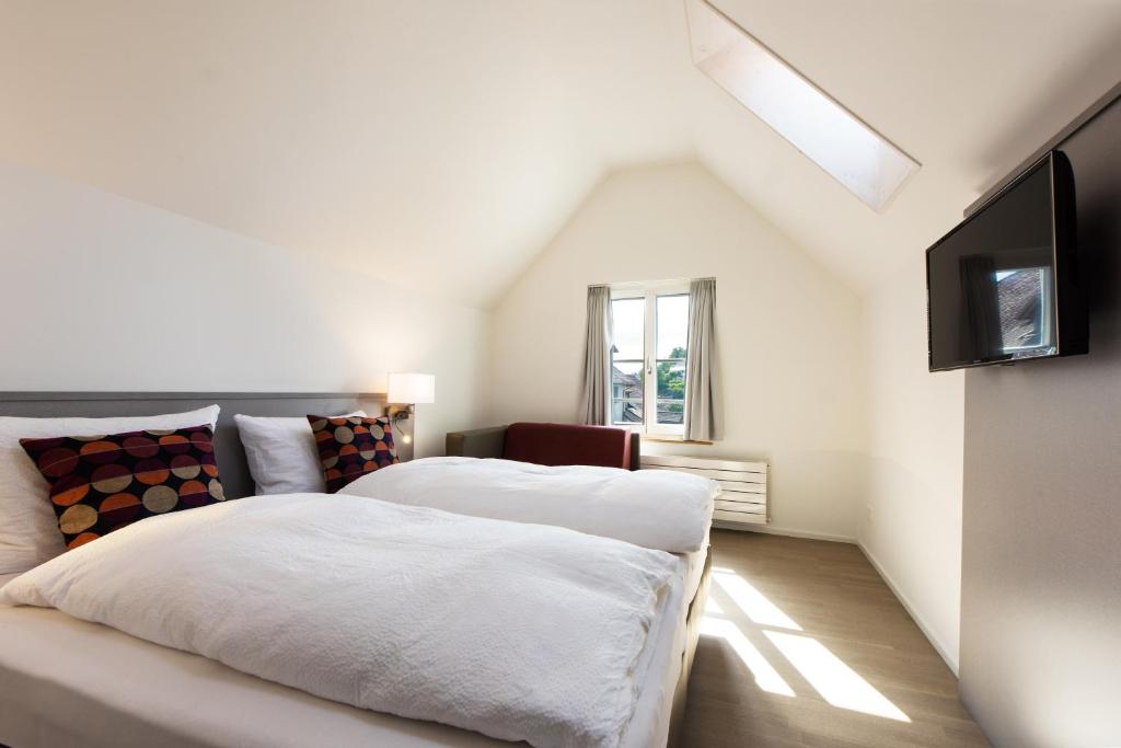 Postel nebo postele na pokoji v ubytování Haus am Schlossberg