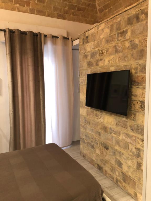 Telewizja i/lub zestaw kina domowego w obiekcie B & B Via Cavour