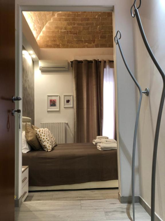 Łóżko lub łóżka w pokoju w obiekcie B & B Via Cavour