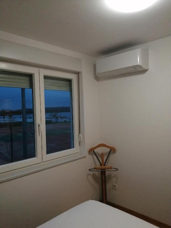Postel nebo postele na pokoji v ubytování SMARAGD on the beach