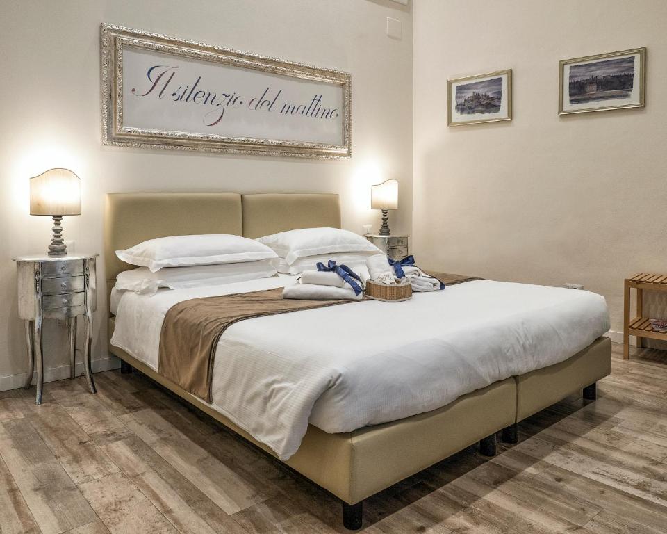 a bedroom with a bed with a sign on the wall at BandBFirenze 8 Cittadella 8 in Florence