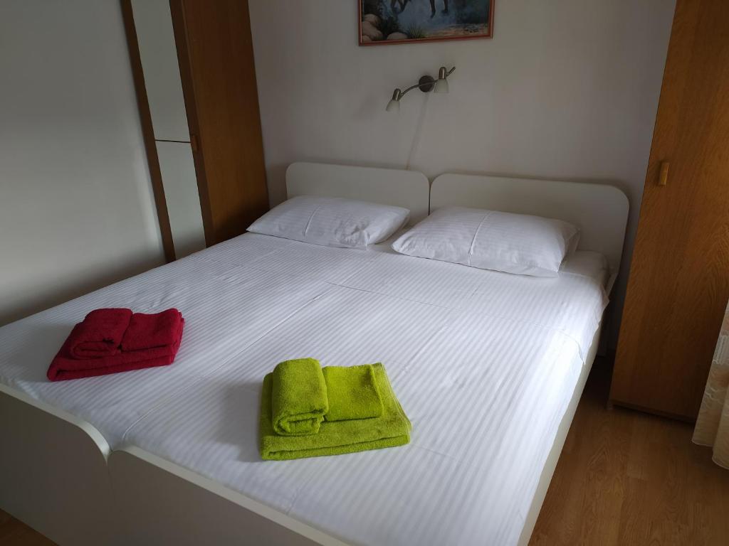Postel nebo postele na pokoji v ubytování Rooms Mario